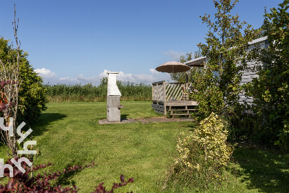 003 4 persoons chalet in Lemmer met buiten open haard en vrij uitzicht over het water