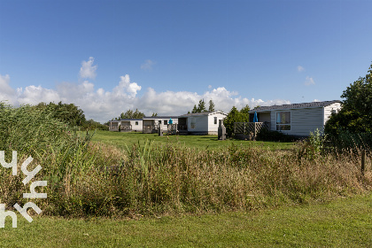 010 4 persoons chalet in Lemmer met buiten open haard en vrij uitzicht over het water