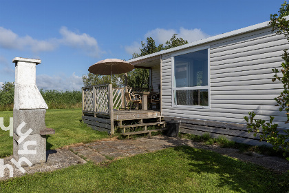 014 4 persoons chalet in Lemmer met buiten open haard en vrij uitzicht over het water