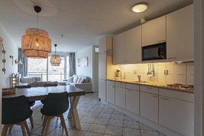 010 Wijde Blick 212 | Callantsoog | Ruim balkon met uitzicht op de duinen 010 Wijde Blick 212 | Callantsoog | Ruim balkon met uitzicht op de duinen