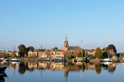 001 Knus 2 persoons appartement met uitzicht op het water en maritiem interieur in Blokzijl