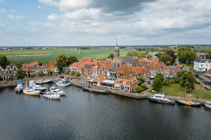 005 Knus 2 persoons appartement met uitzicht op het water en maritiem interieur in Blokzijl