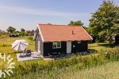 004 Prachtige 3 persoons vakantiewoning met weids uitzicht in omgeving van Kamperland