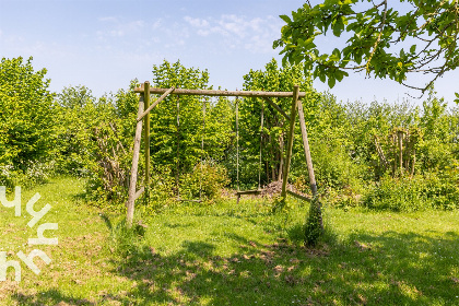 005 Ruim 7 persoons vakantiehuis in een groene omgeving en dichtbij het strand