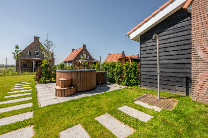 024 Villa voor 7 personen met 2 badkamers, een hottub en Barrel sauna in Ossenisse